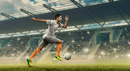 Professional soccer player in action with a ball during the match on a soccer field. Crowded...