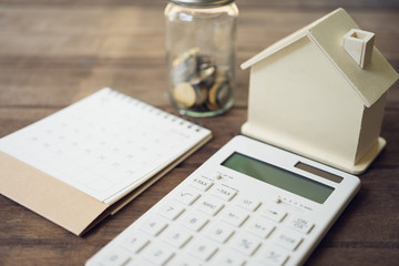 House Models and Equipment Models placed on a Book Rankings (list). Home Repair and Construction . using as background property real estate concept with copy space for your text or design.