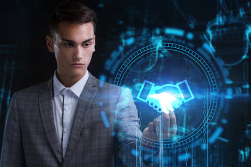 The concept of business, technology, the Internet and the network. A young entrepreneur working on...