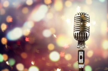 Vintage silver microphone isolated on blurred background