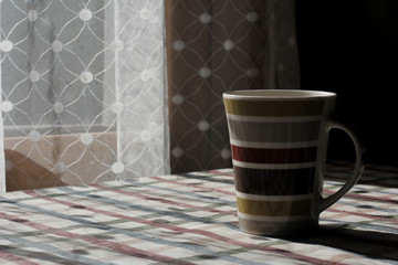 cup of coffee on wooden table