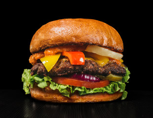 Craft burger is cooking. Consist: red sauce salsa, lettuce, red onion, pickle, cheese, chilli green pepper, air bun and marbled meat beef.