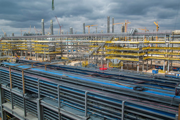 Beautiful large-scale view of the construction of the factory.Pipes, communication routes, constructions, buildings, energy wires.