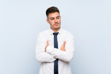 Handsome businessman over isolated blue background thinking an idea