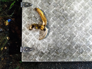 Banana peel rotting on a metal hatch