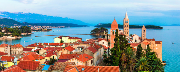 Beautiful Island Rab in Croatia. Townscape panorama over sunset.