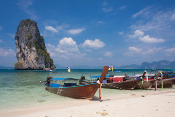 Traditional Thai boats on the beach at Poda island , Thailand