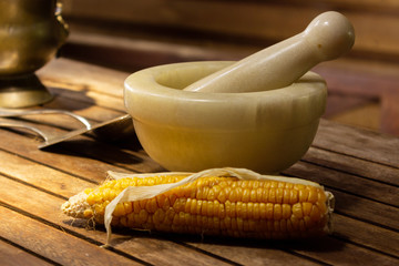 Stone mortar ready for grinding corn, close up.
