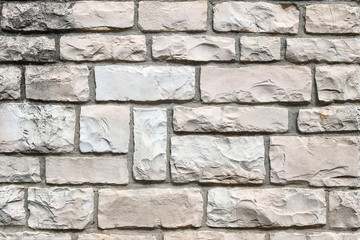 An old brick wall of white color. Background of white bricks. Brick wall texture. Perfect background with space