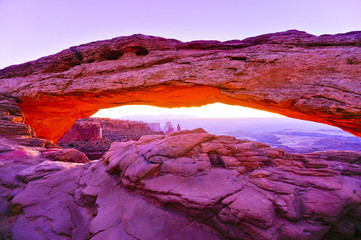 View of the Mesa Arch at dawn in the Canyonlands National Park in Utah, USA.