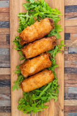 pork spring rolls Rice cakes stuffed with a pork stuffing accompanied by sauce