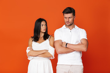 Attractive young couple standing isolated