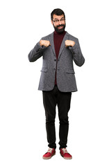 Handsome man with glasses with surprise facial expression over isolated white background