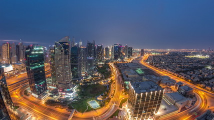 Jumeirah Lake Towers residential district aerial day to night timelapse near Dubai Marina