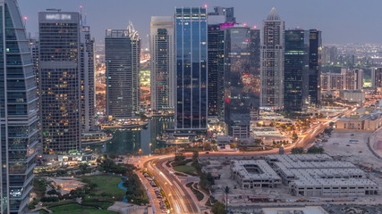 Jumeirah Lake Towers residential district aerial day to night timelapse near Dubai Marina