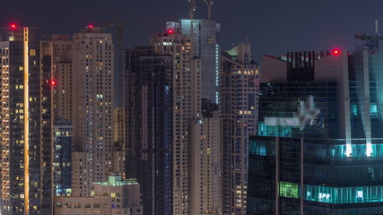 Fototapeta na wymiar Rooftop view on amazing Dubai marina and JLT skyscrapers aerial timelapse, Dubai, United Arab Emirates
