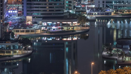 Fototapeta na wymiar Jumeirah Lake Towers residential district aerial night timelapse near Dubai Marina