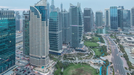 Fototapeta na wymiar Jumeirah Lake Towers residential district aerial day to night timelapse near Dubai Marina