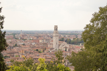 Fototapeta na wymiar Beautiful view of the Lamberti Tower and Ponte Pietra on the banks of the Adige River in Verona, Italy