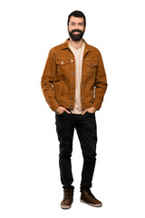 Handsome man with beard laughing over isolated white background