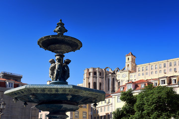 Fototapeta na wymiar bronze fountains at Praca Dom Pedro IV, Rossio square in Lisbon, Portugal
