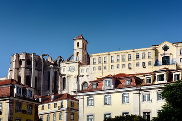 Fototapeta na wymiar View over the buildings and on the apse of the Carmo Convent (Convento do Carmo) from the Rossio square in Lisbon, Portugal