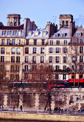 Fototapeta premium Paris, France - march 10th 2017 : Parisian facades with two old towers. 