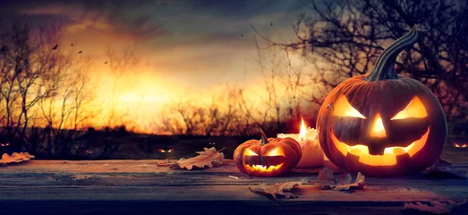 Foto op Aluminium Jack O’ Lanterns In Spooky Forest With Ghost Lights - Halloween Background © Romolo Tavani