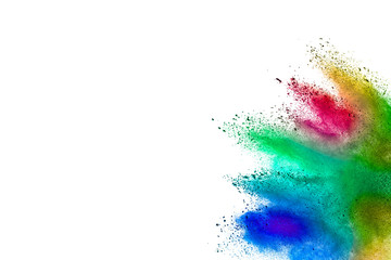 Freeze motion of colorful color powder exploding on white background.  Paint Holi.