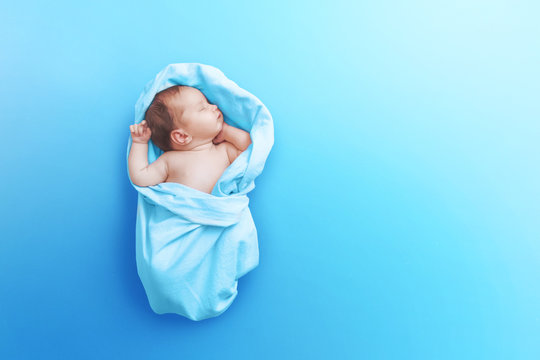 Newborn Baby Boy Sleep On Blue Blanket	