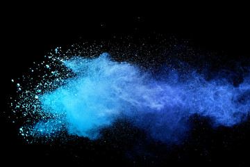 Blue sky color powder explosion on black background.