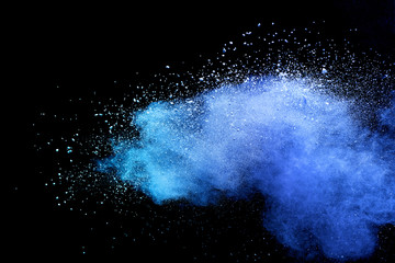Blue sky color powder explosion on black background.