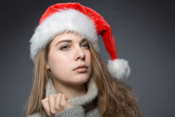 christmas girl with santa claus hat in a turtleneck