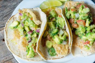 Mexican chicharron tacos with guacamole also called 