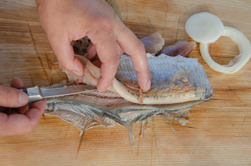 peeling bone marinated herring