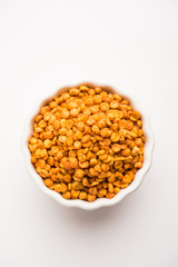 Fried and Spicy Chana Dal Masala is a popular Chakna recipe. served in a bowl. selective focus