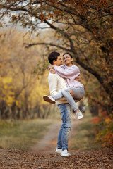 Fototapeta premium Couple in love having fun in beautiful autumn park. happy moments