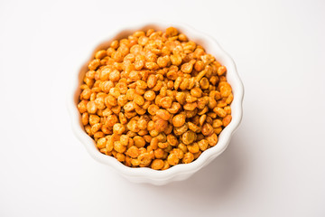 Fried and Spicy Chana Dal Masala is a popular Chakna recipe. served in a bowl. selective focus