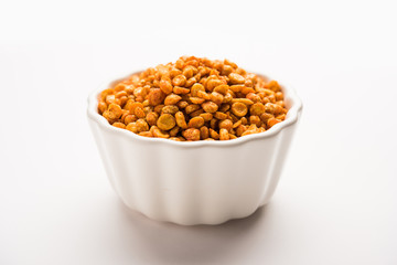 Fried and Spicy Chana Dal Masala is a popular Chakna recipe. served in a bowl. selective focus