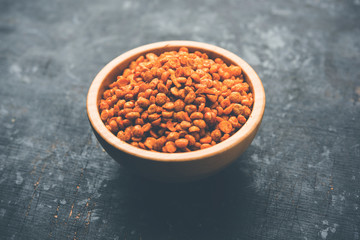 Fried and Spicy Chana Dal Masala is a popular Chakna recipe. served in a bowl. selective focus