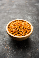 Fried and Spicy Chana Dal Masala is a popular Chakna recipe. served in a bowl. selective focus