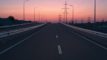 Along the road. Sunset and lightning