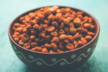 Fried and Spicy Chana Dal Masala is a popular Chakna recipe. served in a bowl. selective focus
