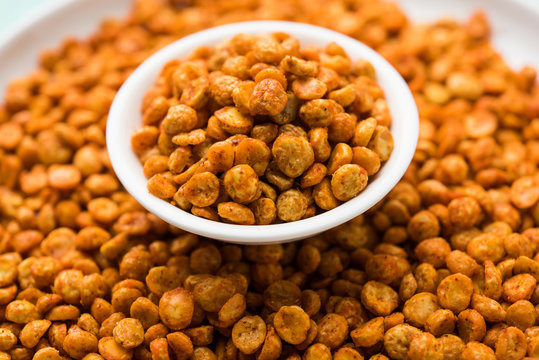 Fried and Spicy Chana Dal Masala is a popular Chakna recipe. served in a bowl. selective focus