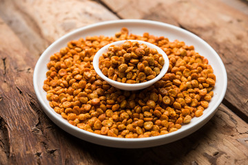 Fried and Spicy Chana Dal Masala is a popular Chakna recipe. served in a bowl. selective focus