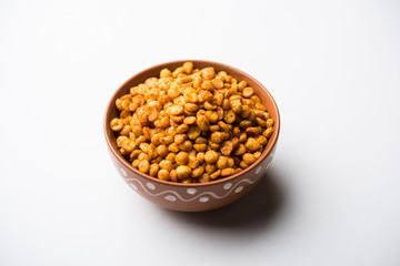 Fried and Spicy Chana Dal Masala is a popular Chakna recipe. served in a bowl. selective focus