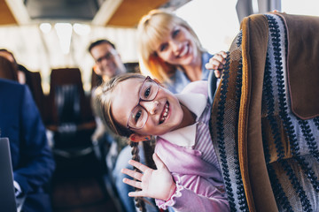 Happy passengers traveling by bus.