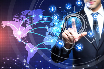 Young executive man touching an imaginary screen