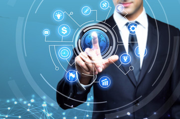 Young executive man touching an imaginary screen