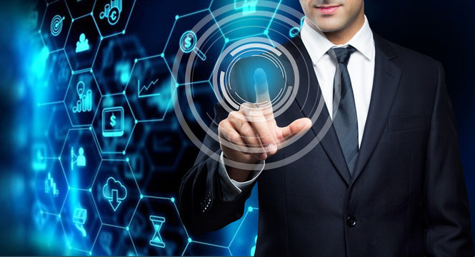 Young executive man touching an imaginary screen